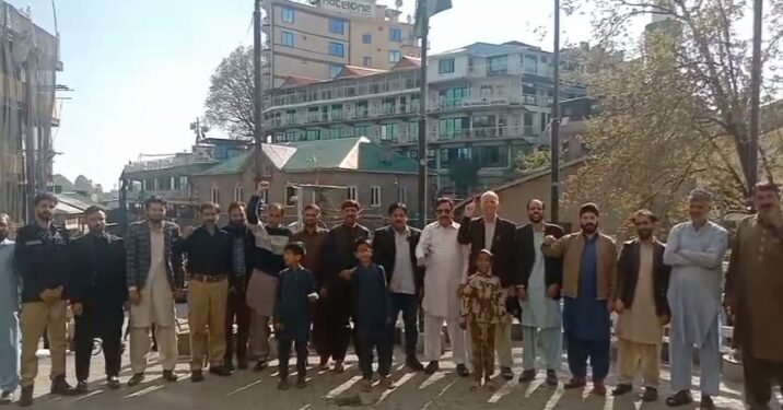 Pakistan Post employees stand shoulder-to-shoulder with the Pakistan Army