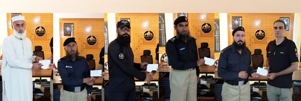 Lower Dir DPO Abdul Salam Khalid distributes relief cheques to police officers