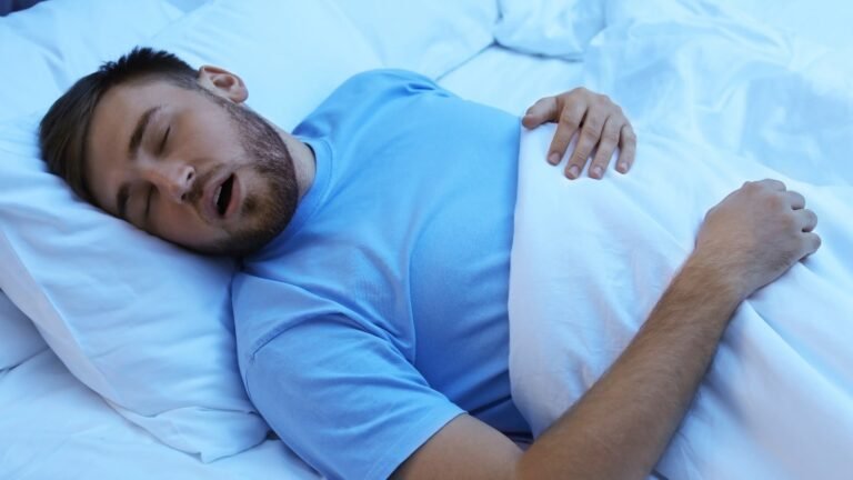 Man sleeping on his back, showing signs of snoring and heart disease risk