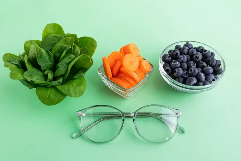 Fresh vegetables, fish, and nuts arranged on a table to promote better eyesight and healthy vision