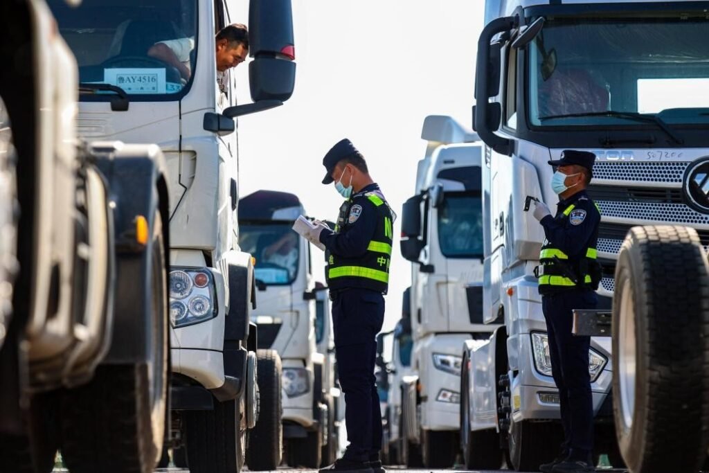 Xinjiang turns from inland heartland to frontier in China's opening up Trucks and freight trains at keupjras Xinjiang border port driving cross-border trade