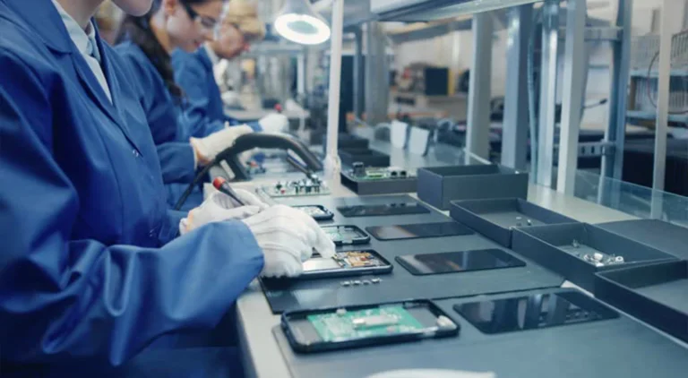 New mobile brand assembly in Pakistan – factory workers at smartphone production line