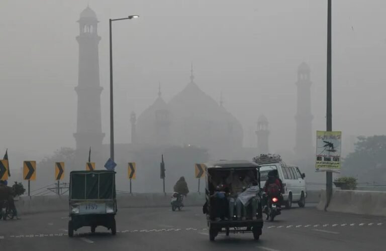 Smog-covered skyline of Lahore with historic landmarks obscured by pollution