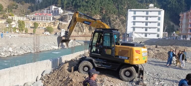 Excavators demolishing illegal constructions along Swat River in Kalam