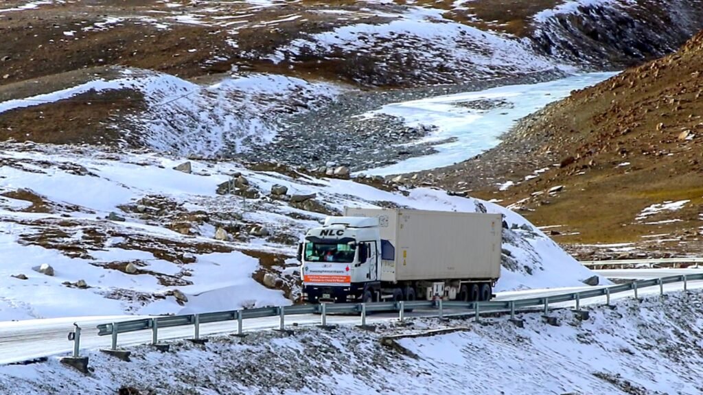 NLC reefer trucks transporting meat export consignments through Khunjerab Pass to China.