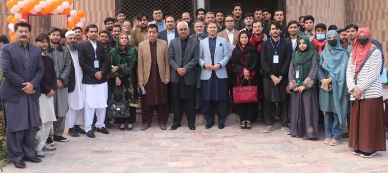 Participants attend a University of Peshawar seminar discussing NFC and KP’s fiscal challenges.