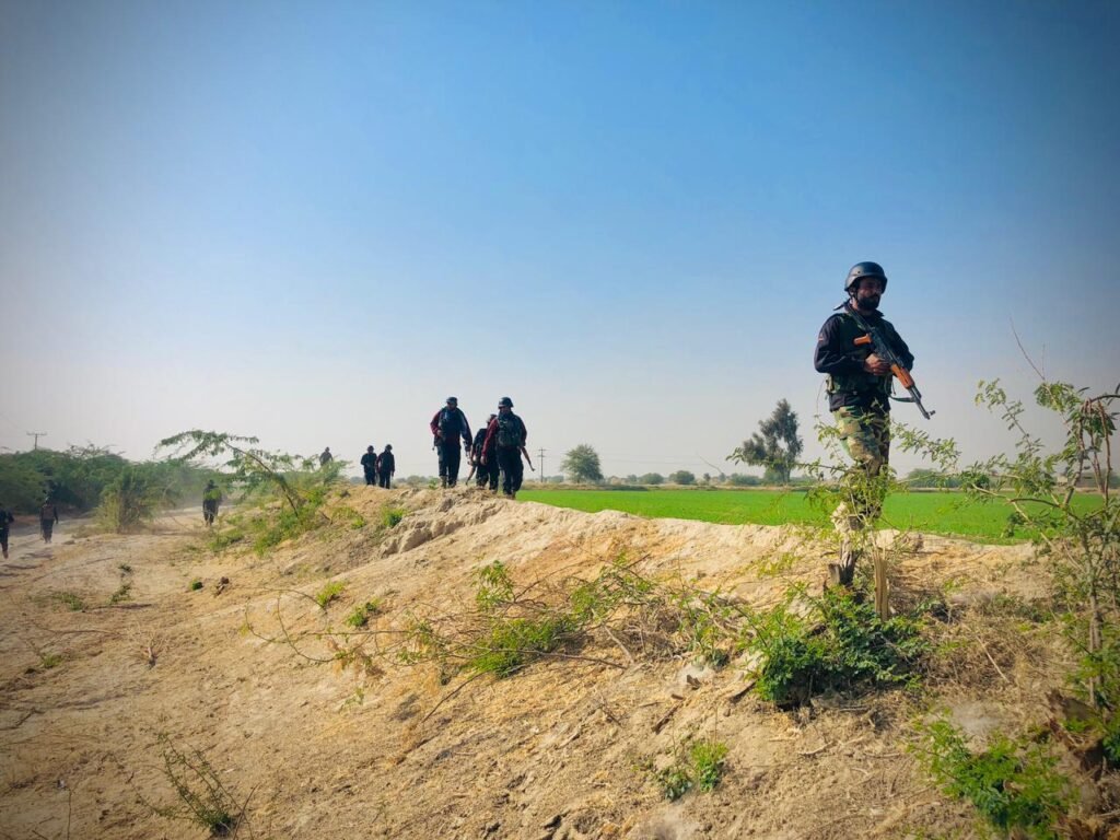 Police personnel conduct a search operation in the Panyala area of D.I. Khan.