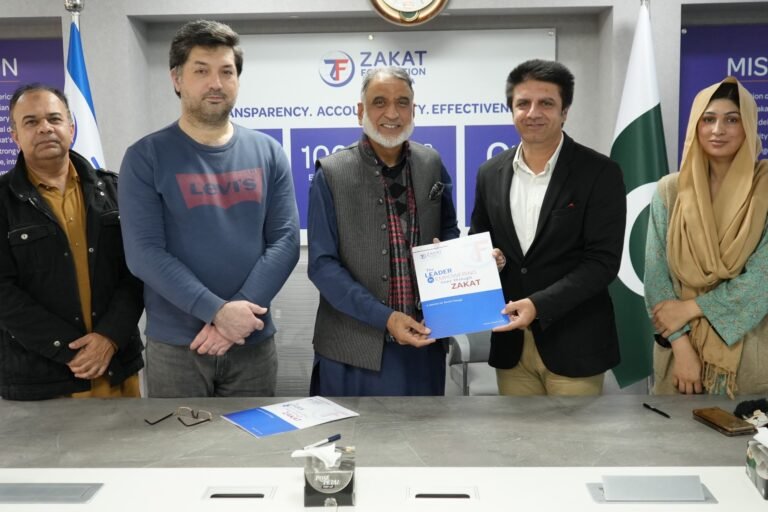 Representatives of Social Cooperation Initiative and Zakat Foundation of America sign an MoU in Islamabad.