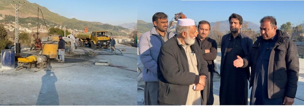 Engineers inspect turbine machinery at the Koto Hydel Power Project in Timergara during repair work.