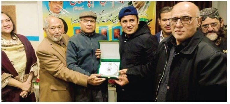 Journalist Imran Ammar receives recognition at a Rawalpindi ceremony for 15 years of service in journalism.