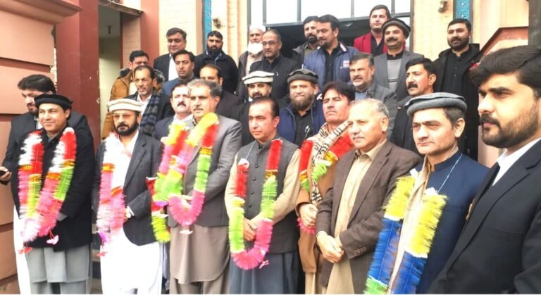Newly elected office-bearers of the Mardan Press Club pose after the conclusion of annual elections in Mardan.
