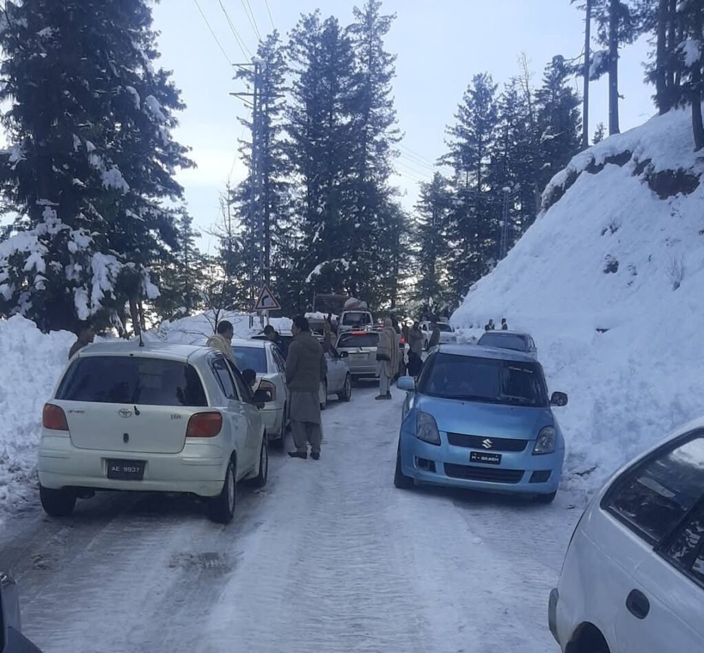 Civil Defence volunteers clear snow and rescue stranded vehicles after heavy snowfall in Shangla district.