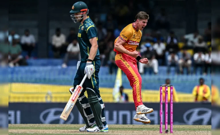 Zimbabwe players celebrate after defeating Australia in T20 World Cup match at R. Premadasa Stadium.