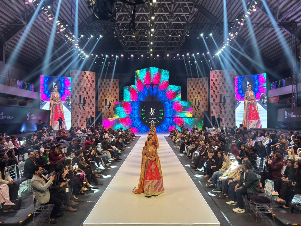 Designers present collections on the runway during Day 2 of LAAM Fashion Week in Lahore.