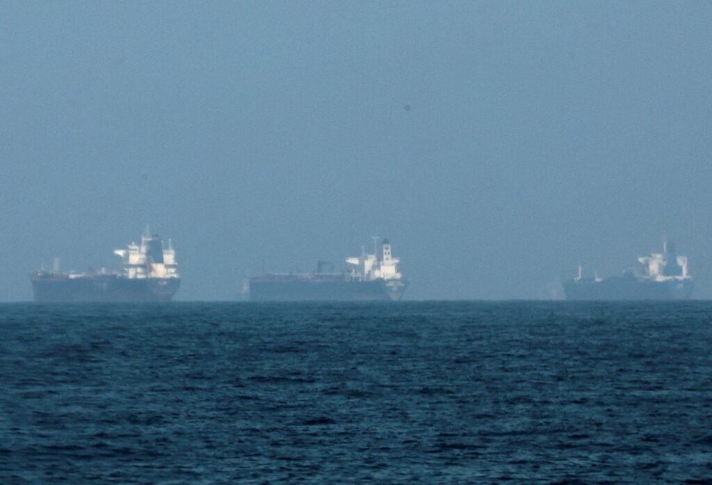 Iran warns of oil blockade if attacks continue as Trump threatens stronger US response Oil tankers passing through the Strait of Hormuz amid tensions over Iran oil blockade threats and US response.