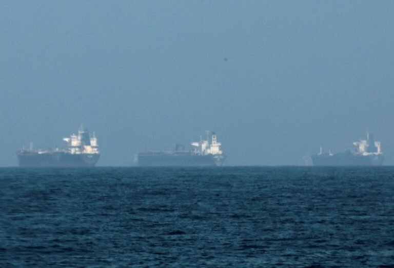 Oil tankers passing through the Strait of Hormuz amid tensions over Iran oil blockade threats and US response.