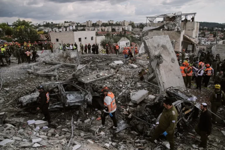 Rescue teams search rubble in Iran after airstrikes as the Iran–Israel conflict causes hundreds of casualties.