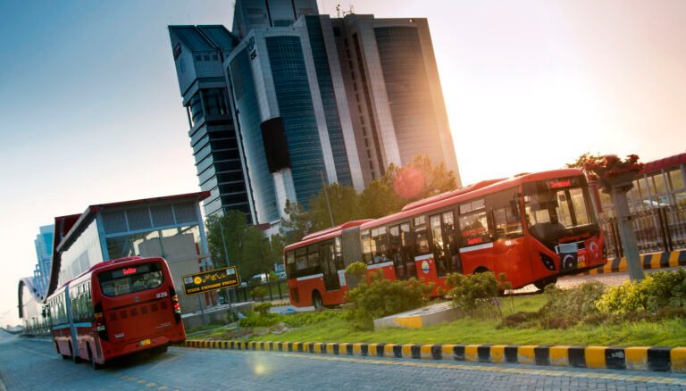 A Metro Bus catches fire near Kalma Chowk in Lahore as passengers are evacuated safely.