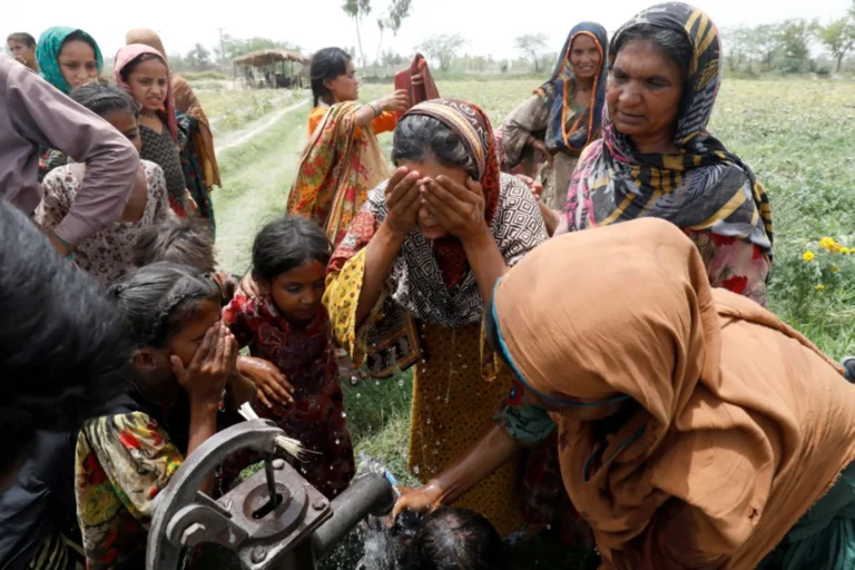 Women and children receiving support under the climate resilience project in flood-affected districts of Pakistan.