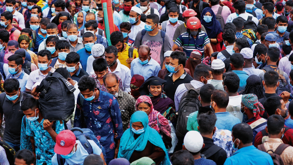 People gathered in a crowded urban area in Pakistan amid rising population projections