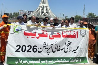 Sanitation workers collect sacrificial animal waste during WSSCM's Eid-ul-Adha operation in Mardan