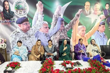 Participants attending an anniversary ceremony marking Maarka-e-Haq and Bunyan-un-Marsoos in Lahore, Pakistan.