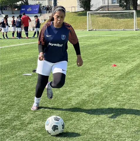 Five female footballers from Lyari during training at the PSG Academy in Qatar.