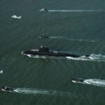 Pakistan Navy Hangor-class submarine PNS/M Hangor arrives in Karachi during a ceremonial welcome.