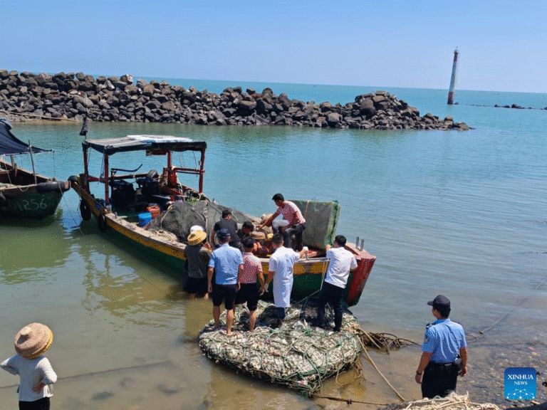 Chinese businessman Qin Jianping recovers after surviving seven days adrift at sea near Hainan.