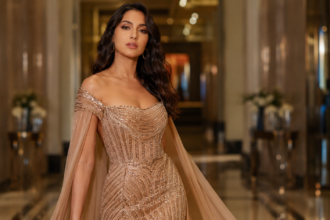 Nora Fatehi Champions music video shows the performer in a football-themed setting with cheering fans.