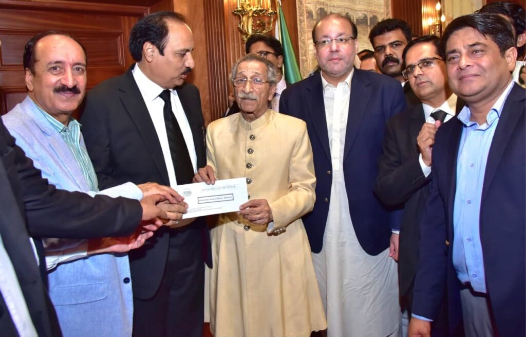 Punjab government distributes grants to bar associations during a ceremony in Lahore attended by legal and government officials.