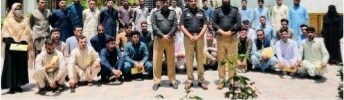 Newly recruited constables receive appointment letters during a Dir Upper Police induction ceremony.
