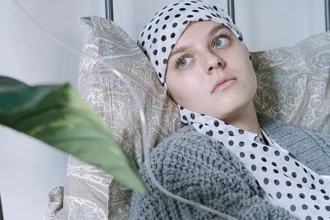 A medical researcher reviews data on biological ageing and cancer risk among younger adults.