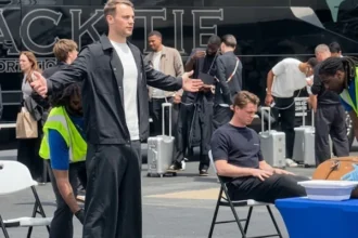 German national football team undergoing airport security screening before boarding flight for FIFA World Cup 2026 match.