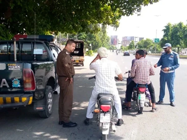 Traffic police inspect vehicle records after discovering 421 vehicles registered to one individual in Lahore.