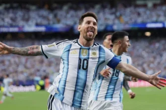 Lionel Messi celebrates after scoring for Argentina as he equals the World Cup goal record.