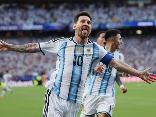 Lionel Messi celebrates after scoring for Argentina as he equals the World Cup goal record.