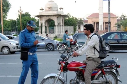 A young motorcycle rider receives a special motorcycle licence under Punjab’s new traffic policy.
