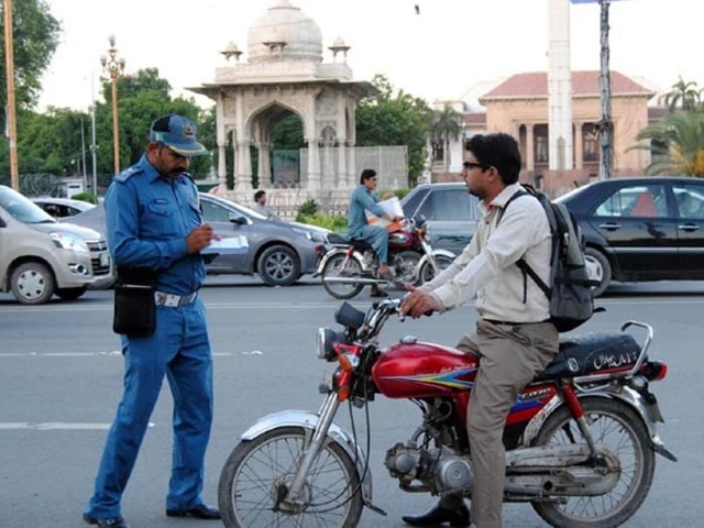 A young motorcycle rider receives a special motorcycle licence under Punjab’s new traffic policy.