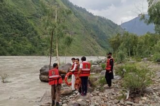 Heavy machinery clears a monsoon-triggered landslide from the Alpuri–Bisham highway in Shangla