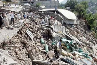 Excavation work in Balakot where the remains of a child missing since the 2005 Kashmir earthquake were discovered.
