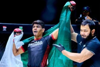 Pakistani MMA fighters Muhammad Jawad Ahmed and Muhammad Saqib celebrating their gold medal victories at the GAMMA Asian MMA Championship in Malaysia.