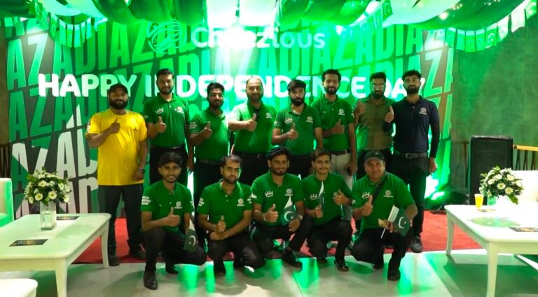 Cheezious employees and community members take part in an Independence Day rally at the Gulberg branch in Lahore.