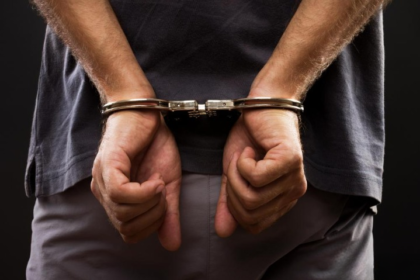 Police officers after rescuing a kidnapped toddler and arresting the suspect