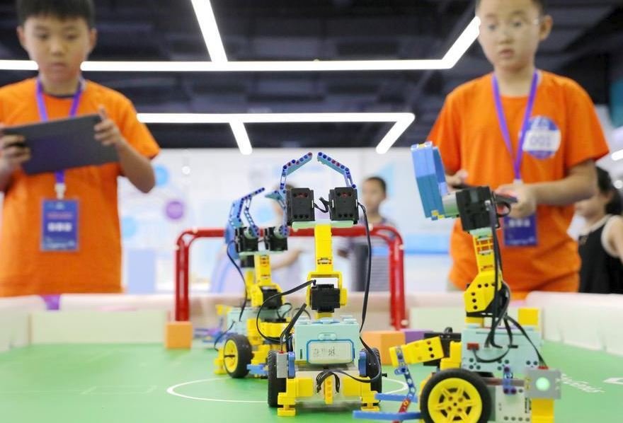 AI study tours surge across China as teenagers get hands-on with robotics