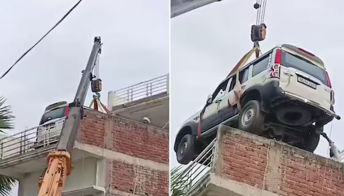 A Man Uses Crane to Lift Car Onto Roof Over Theft Fears