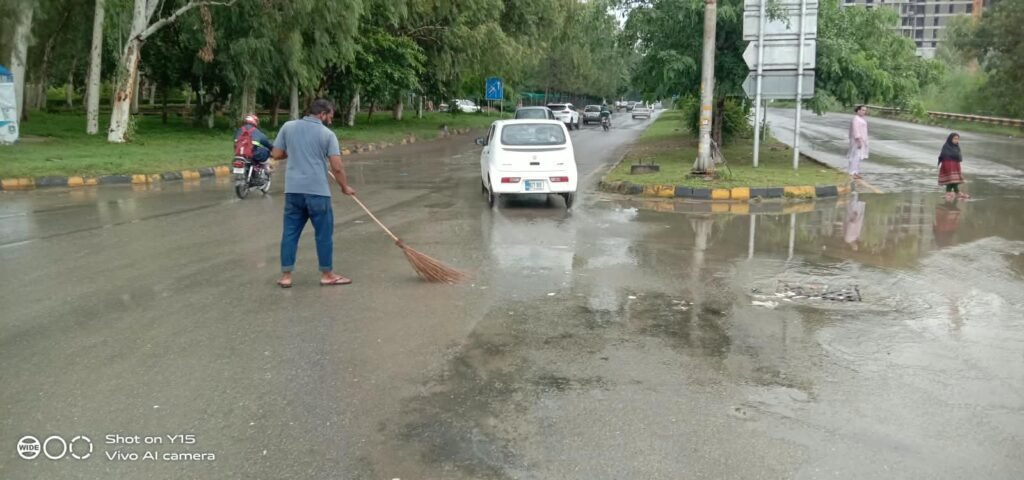 CDA Teams Clear Rainwater Across Islamabad After Downpour CDA sanitation workers clearing rainwater and drainage points across Islamabad after rainfall