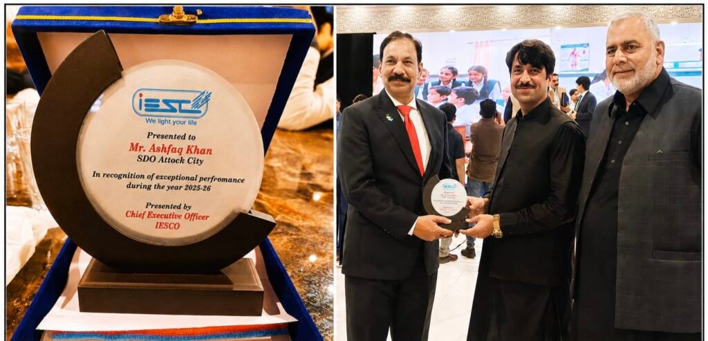 WAPDA Attock SDO Ashfaq Khan receives the Best of the Year Award from IESCO Chief Executive Officer Engineer Chaudhry Khalid Mahmood.