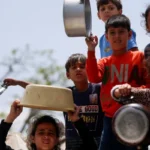 Palestinian families in Gaza face severe food shortages as the World Food Programme reduces food assistance and daily meal distributions due to funding constraints.