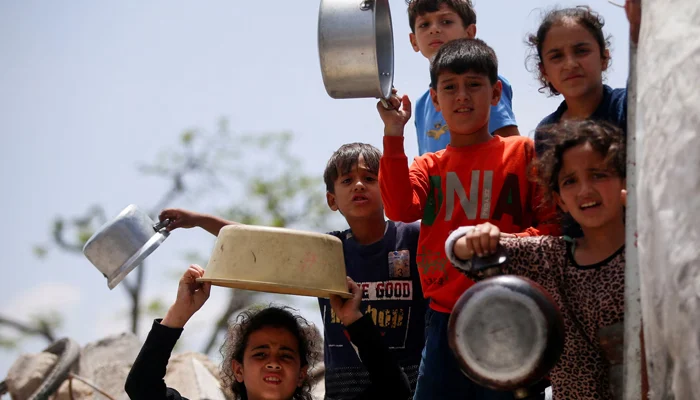 Palestinian families in Gaza face severe food shortages as the World Food Programme reduces food assistance and daily meal distributions due to funding constraints.
